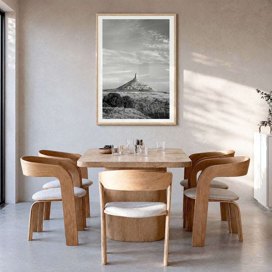 Nebraska Photo Poster in a natural wood frame, hanging in a dining room, white border