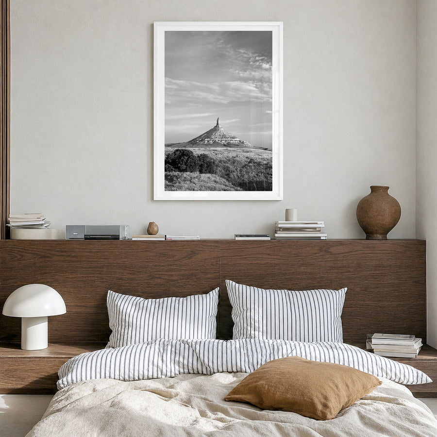 Nebraska Photo Poster in a white wood frame, hanging in a bedroom, white border