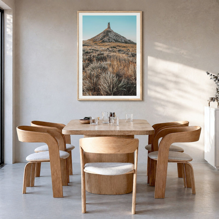 Nebraska Photo Poster in a natural wood frame, hanging in a dining room, white border