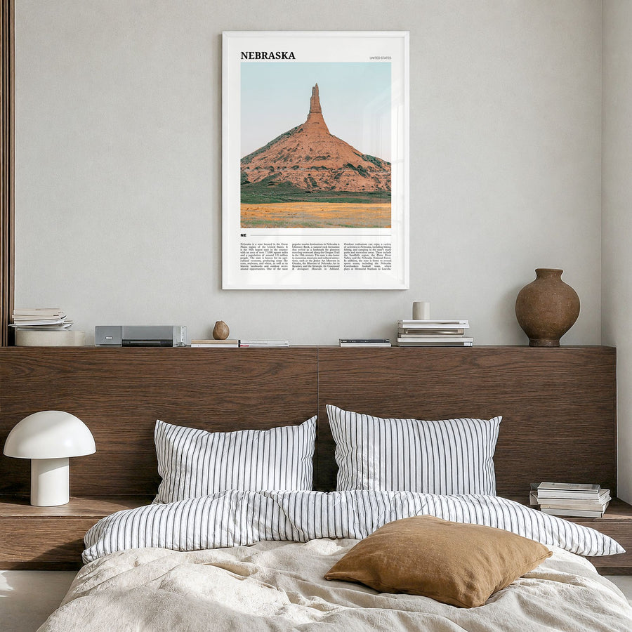 Nebraska Travel No 1 Poster in a white wood frame, hanging in a bedroom