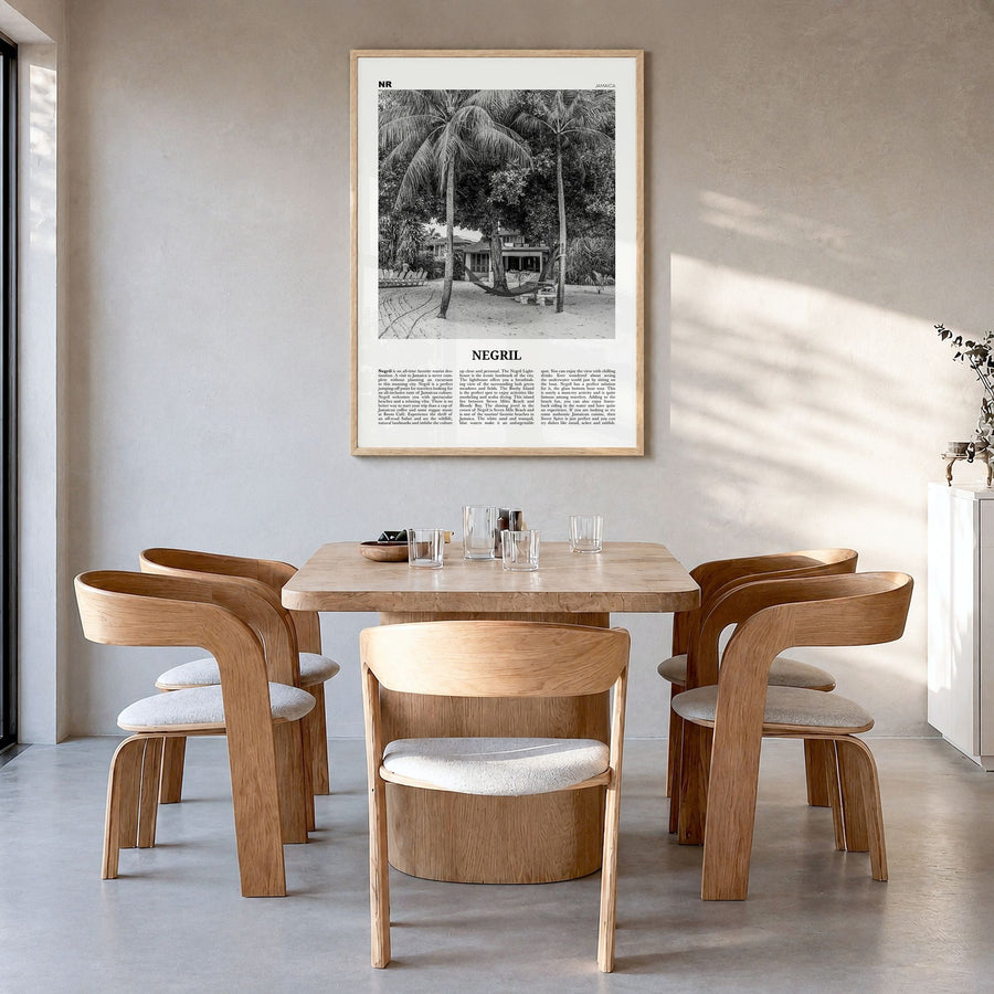Negril Newspaper Poster in a natural wood frame, hanging in a dining room