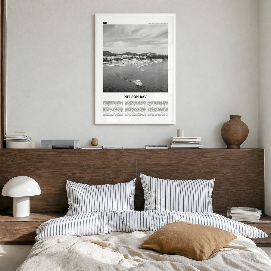 Nelson Bay Newspaper Poster in a white wood frame, hanging in a bedroom