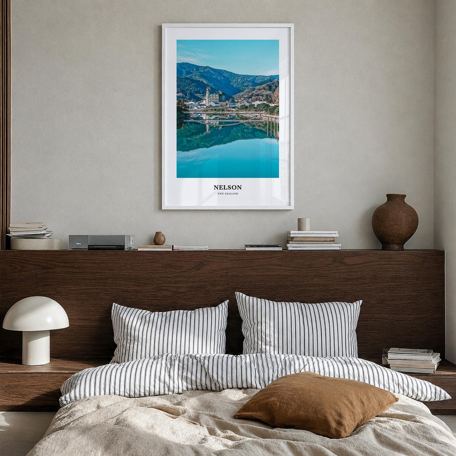 Nelson colorful classic poster of New Zealand – vertical wall art in white wood frame, hanging on wall