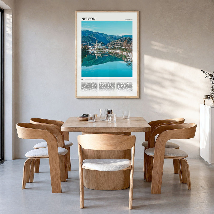 Nelson Travel Poster in a natural wood frame, hanging in a dining room
