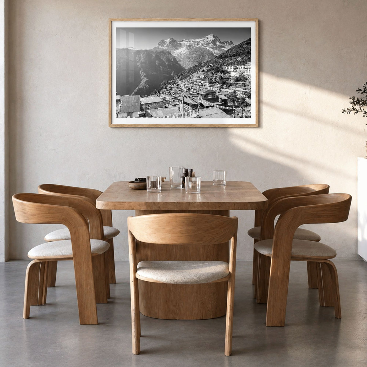 Nepal Photo Poster in a natural wood frame, hanging in a dining room, white border