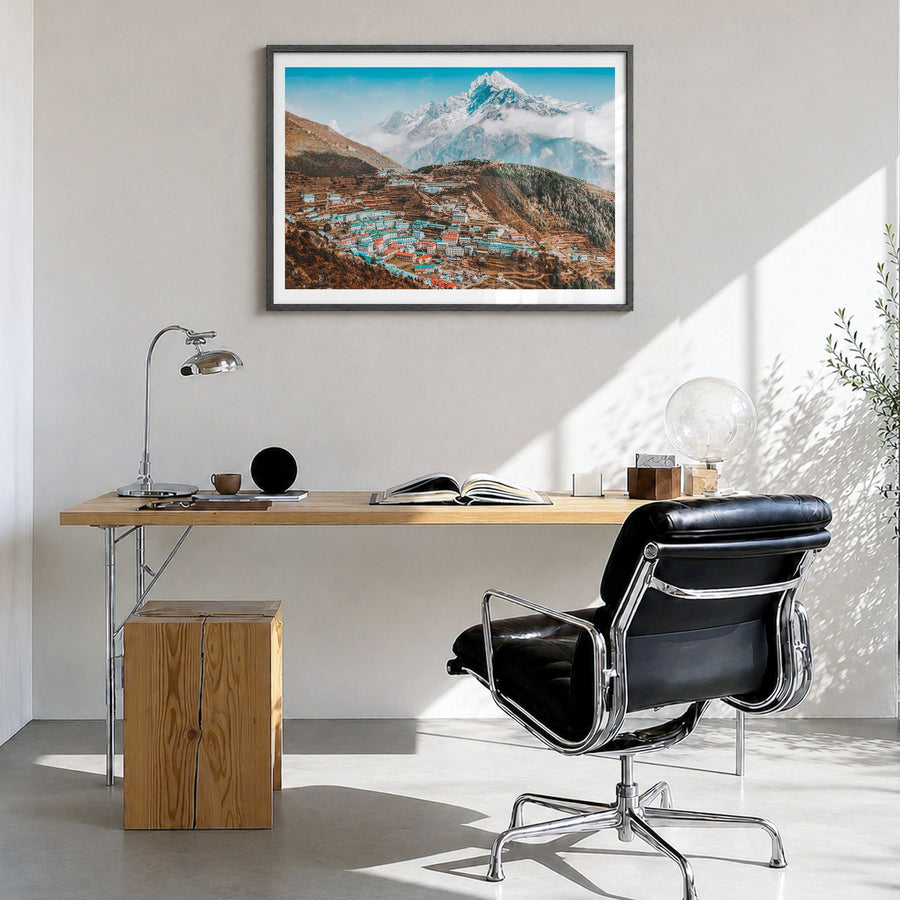 Nepal Photo Poster in a black wood frame, hanging in a bright home office, white border