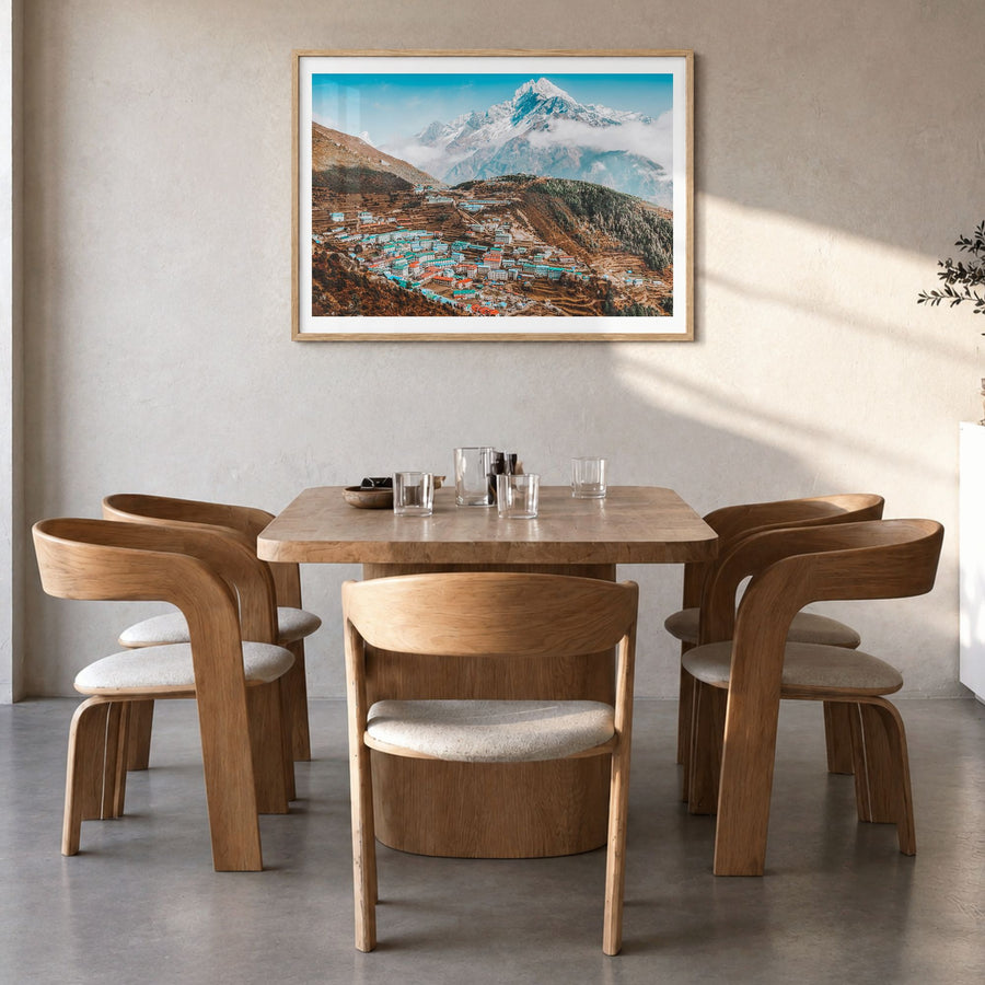 Nepal Photo Poster in a natural wood frame, hanging in a dining room, white border