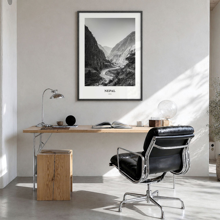 Nepal Classic No 1 Poster in a black wood frame, hanging in a bright home office