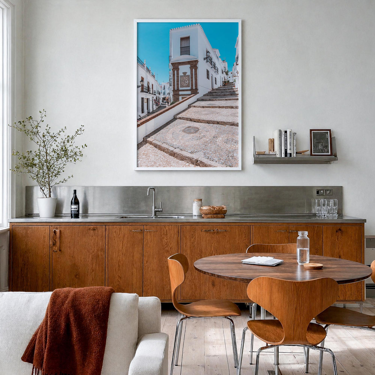 Nerja colorful photo poster of Spain – vertical wall art in white wood frame, hanging on wall