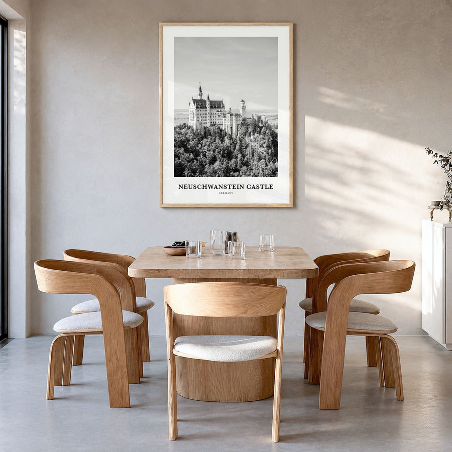 Neuschwanstein Castle Classic Poster in a natural wood frame, hanging in a dining room