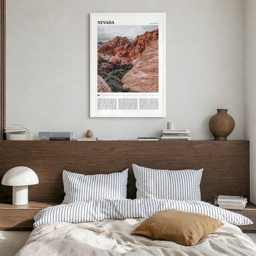 Nevada Travel Poster in a white wood frame, hanging in a bedroom