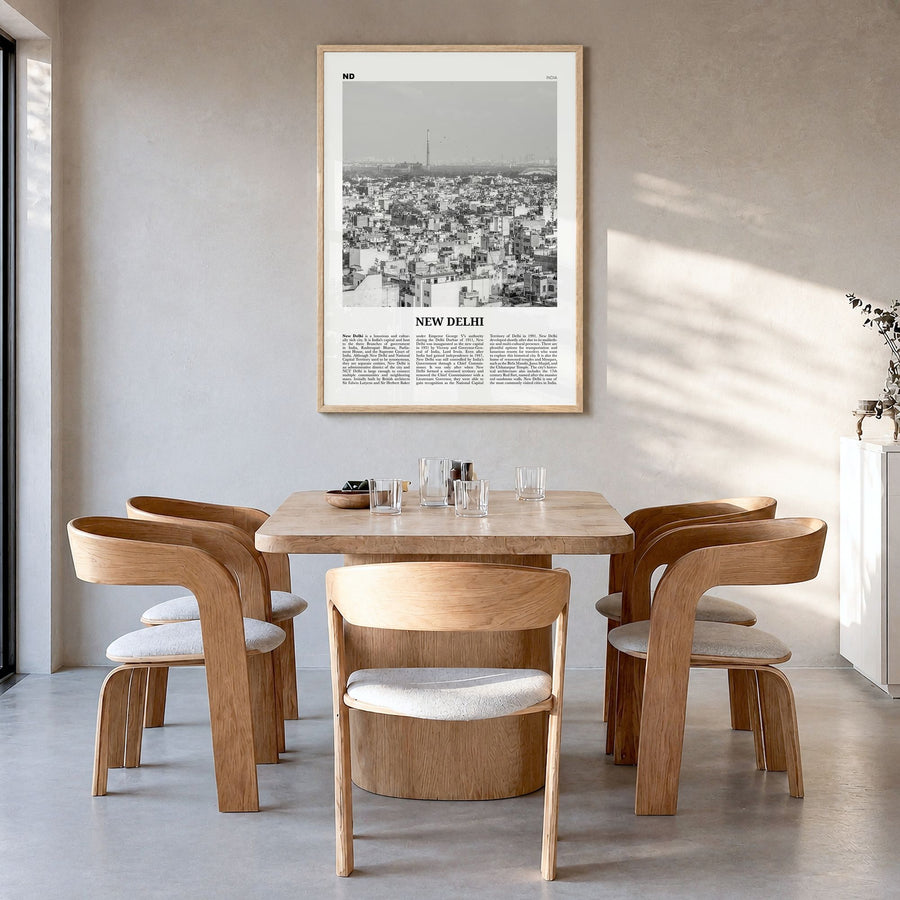 New Delhi Newspaper Poster in a natural wood frame, hanging in a dining room
