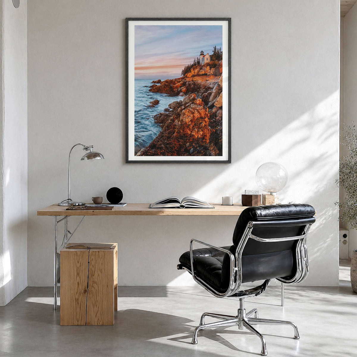 New England Photo Poster in a black wood frame, hanging in a bright home office, white border