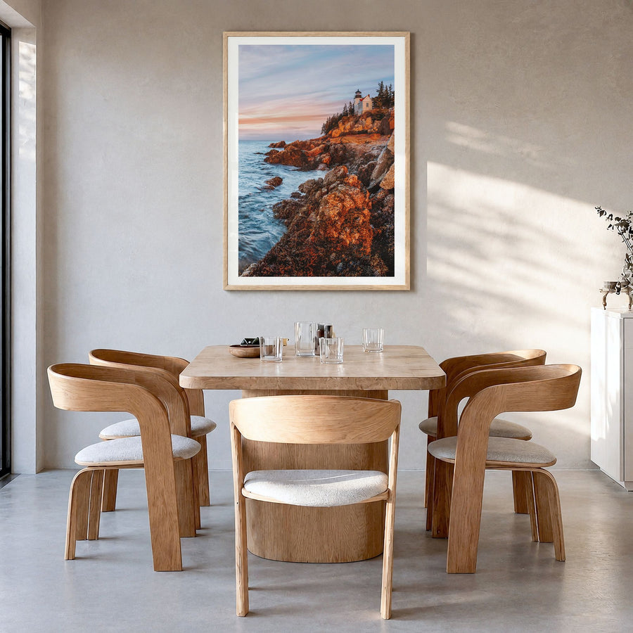 New England Photo Poster in a natural wood frame, hanging in a dining room, white border