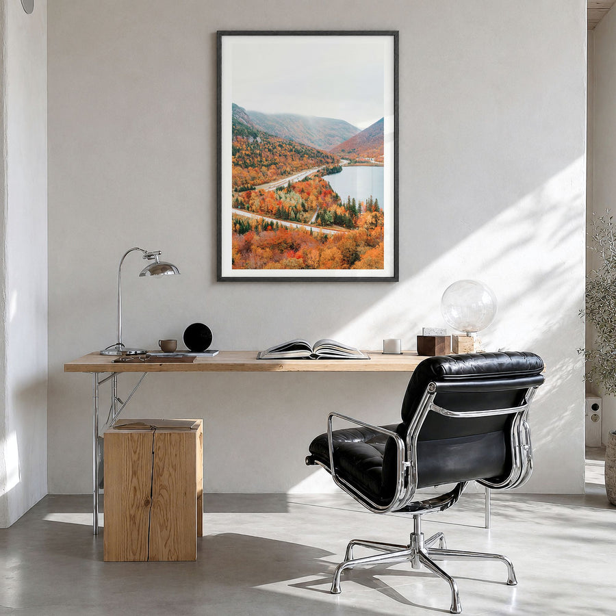 New Hampshire Photo Poster in a black wood frame, hanging in a bright home office, white border