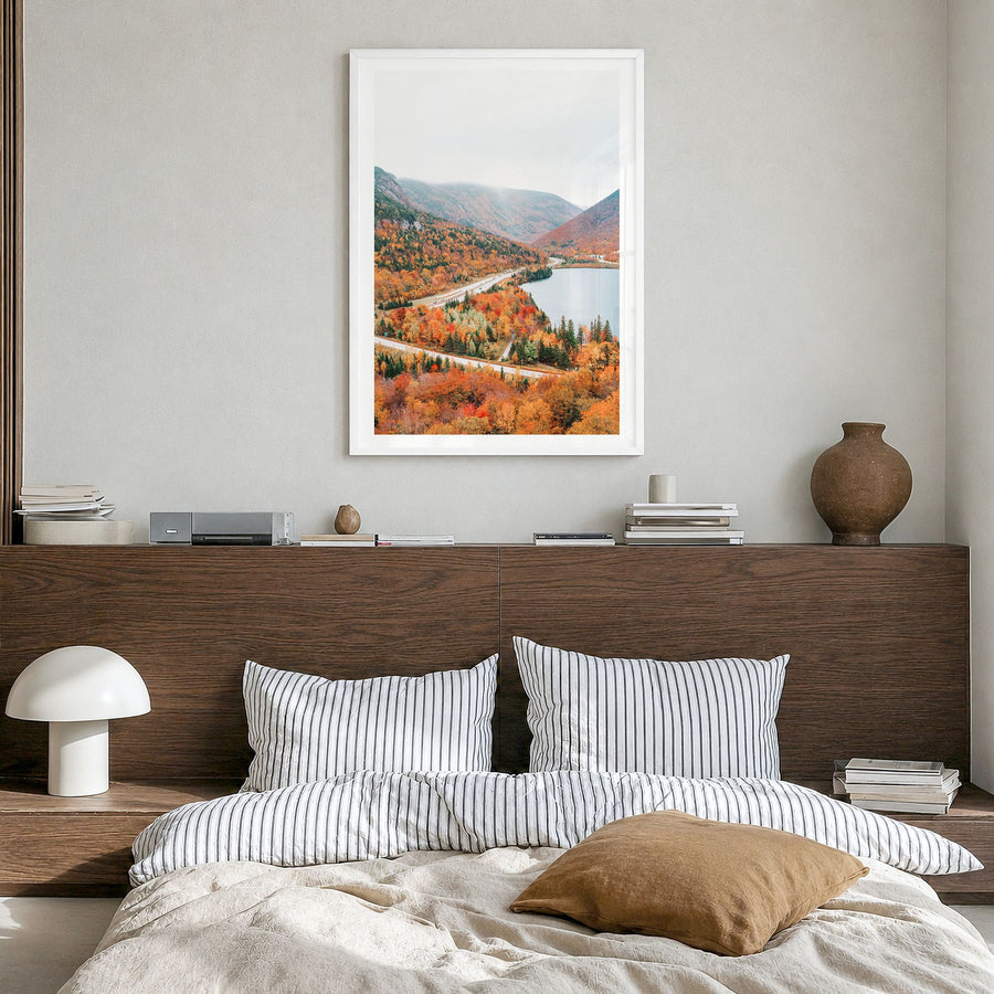 New Hampshire Photo Poster in a white wood frame, hanging in a bedroom, white border