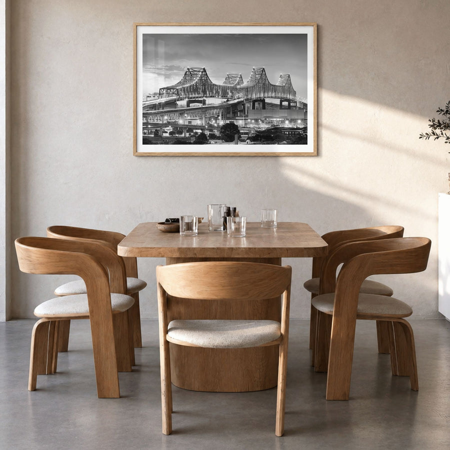 New Orleans Photo Poster in a natural wood frame, hanging in a dining room, white border