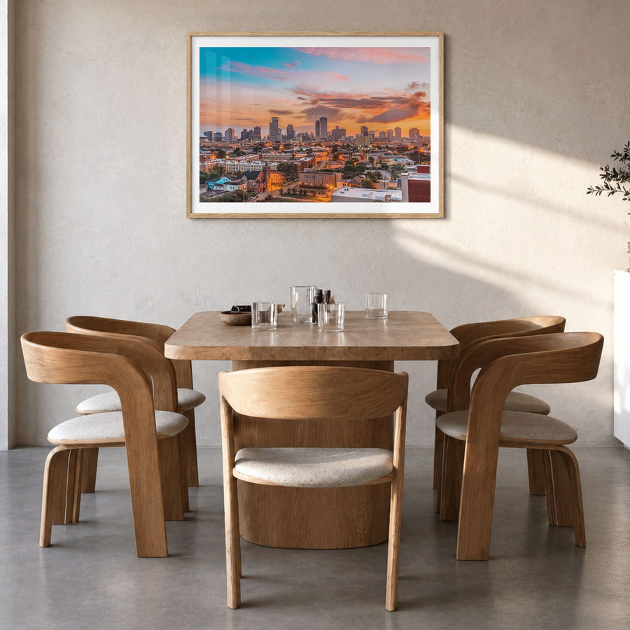 New Orleans Photo Poster in a natural wood frame, hanging in a dining room, white border