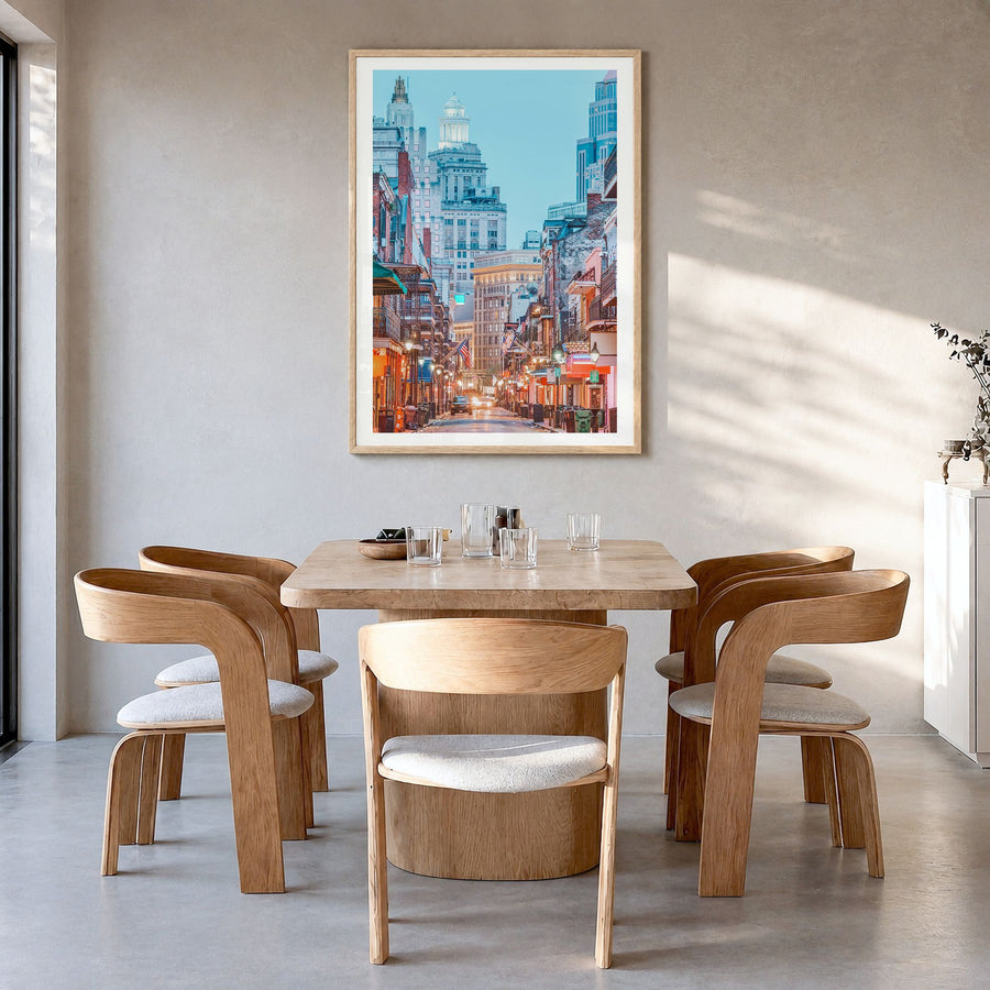New Orleans Photo No 1 Poster in a natural wood frame, hanging in a dining room, white border
