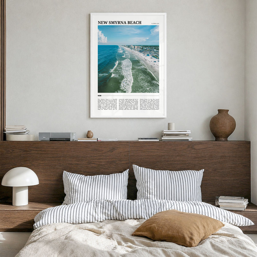 New Smyrna Beach Travel Poster in a white wood frame, hanging in a bedroom
