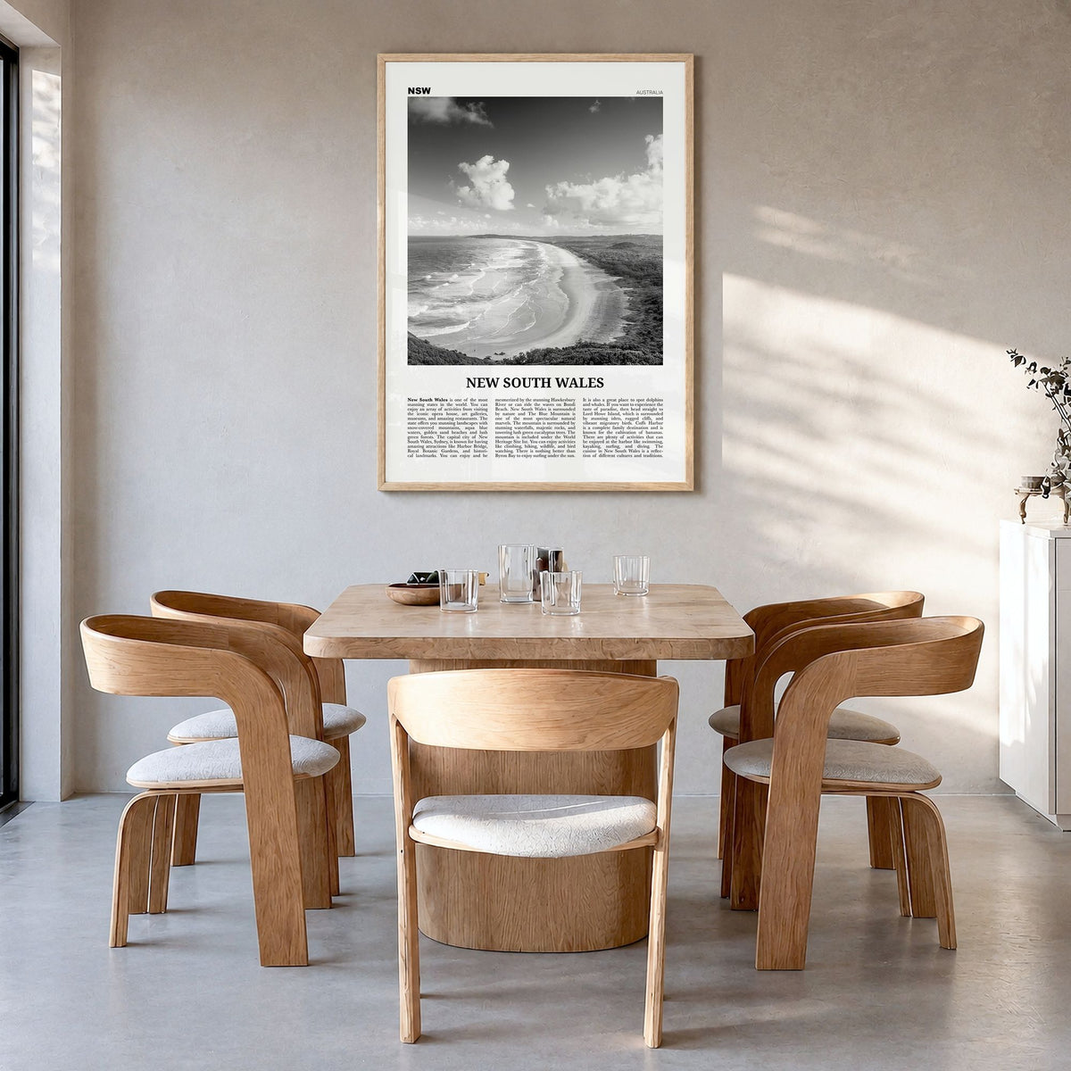 New South Wales Newspaper Poster in a natural wood frame, hanging in a dining room