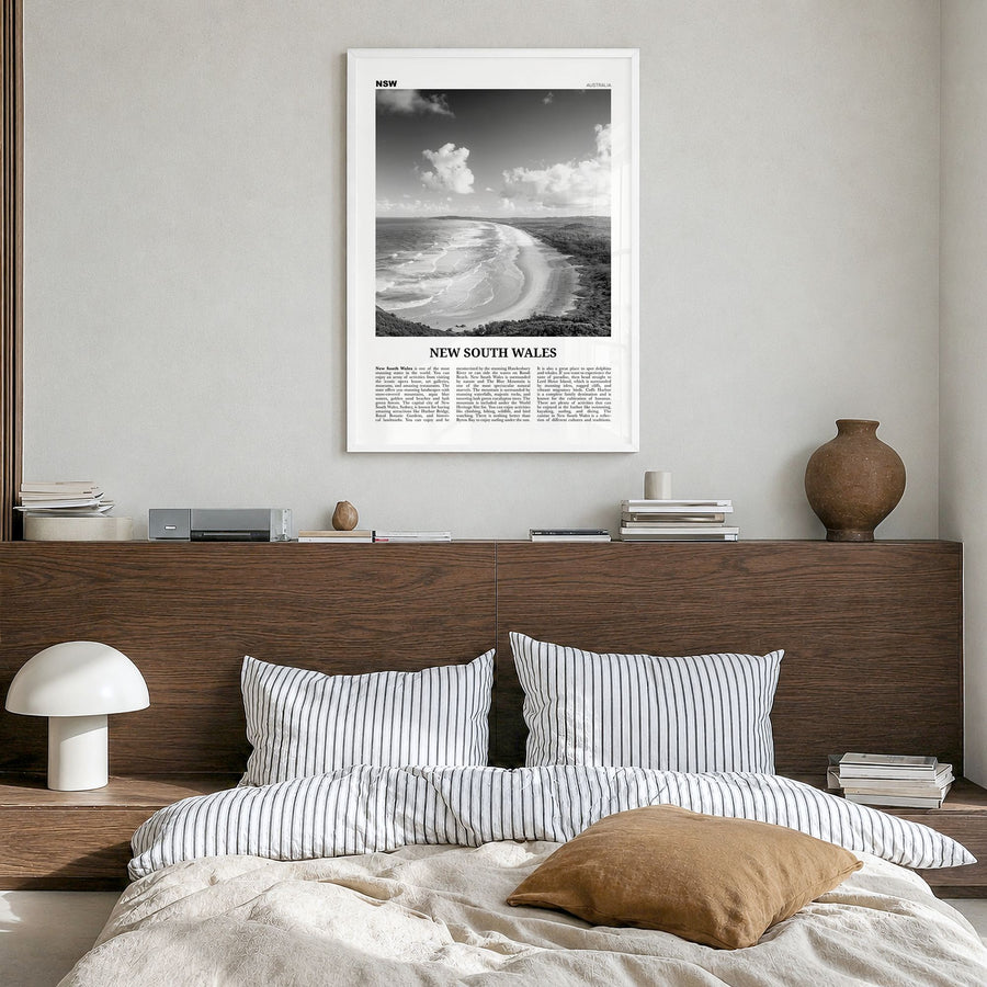 New South Wales Newspaper Poster in a white wood frame, hanging in a bedroom