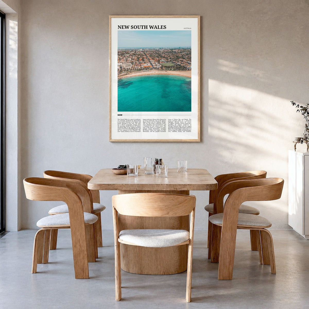 New South Wales Travel No 1 Poster in a natural wood frame, hanging in a dining room
