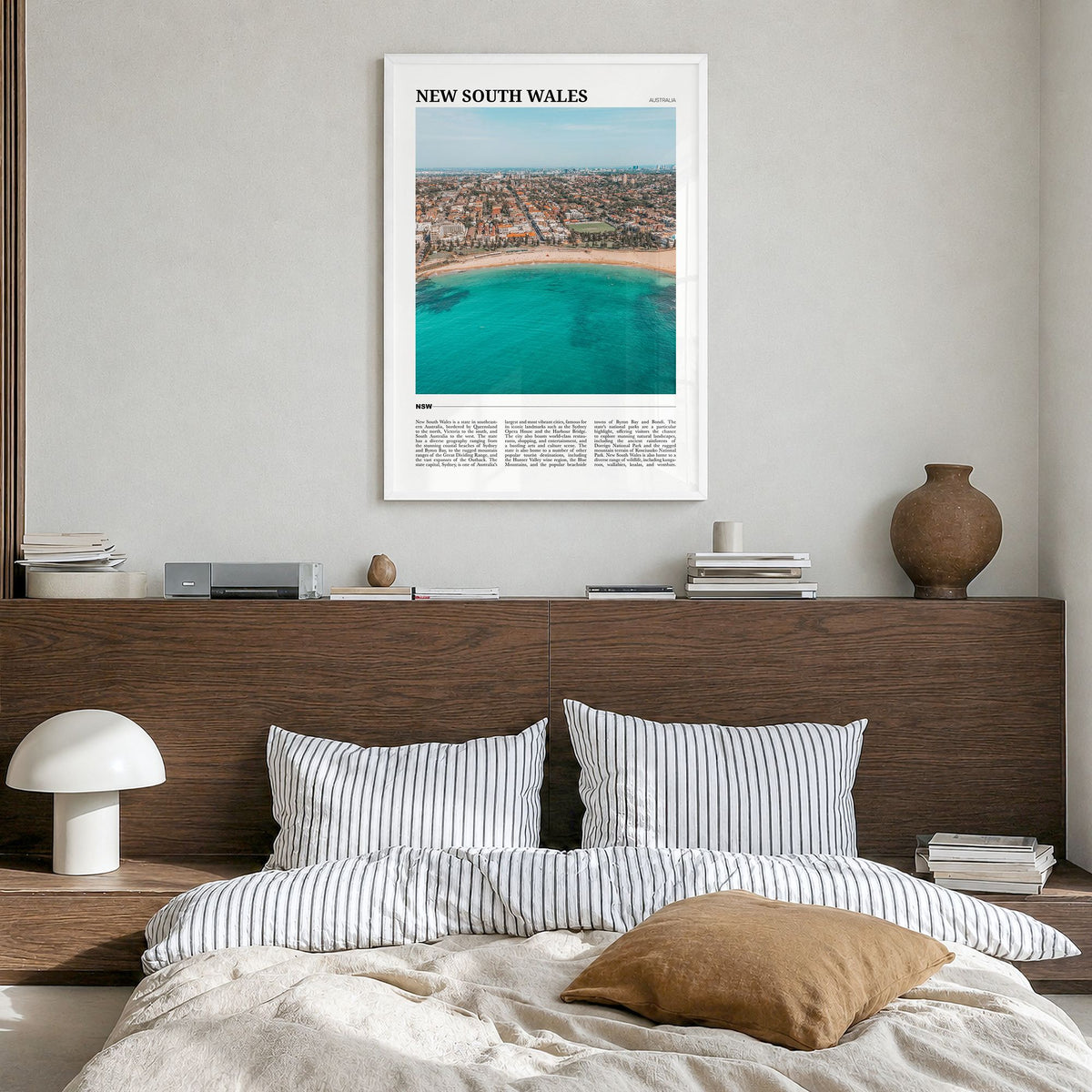 New South Wales Travel No 1 Poster in a white wood frame, hanging in a bedroom