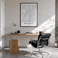 New York City black & white map poster of New York, USA – vertical wall art in black wood frame, hanging on wall