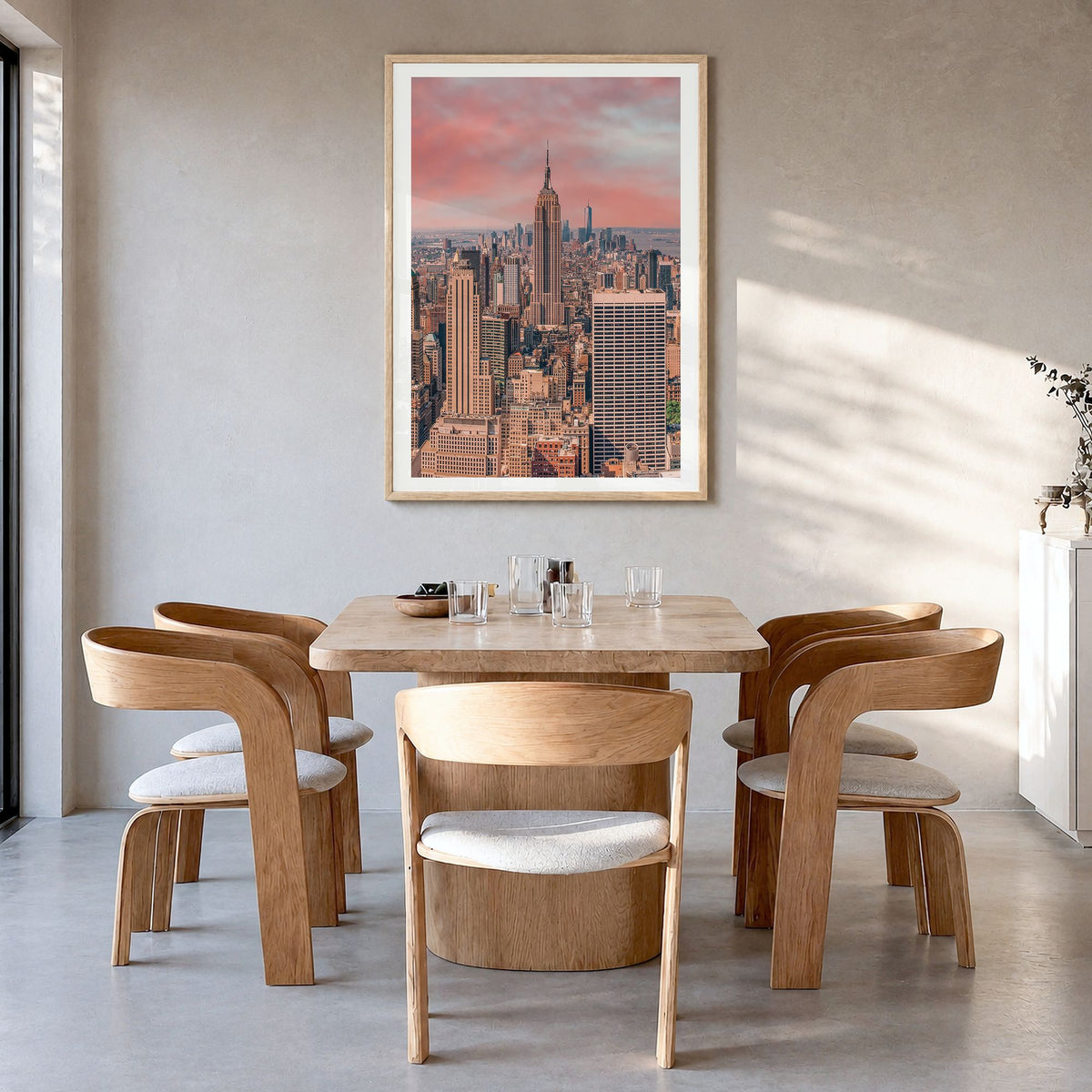 New York City Photo No 1 Poster in a natural wood frame, hanging in a dining room, white border