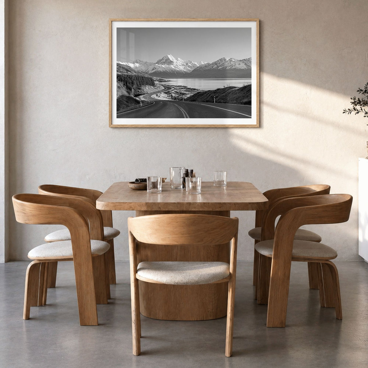 New Zealand Photo Poster in a natural wood frame, hanging in a dining room, white border