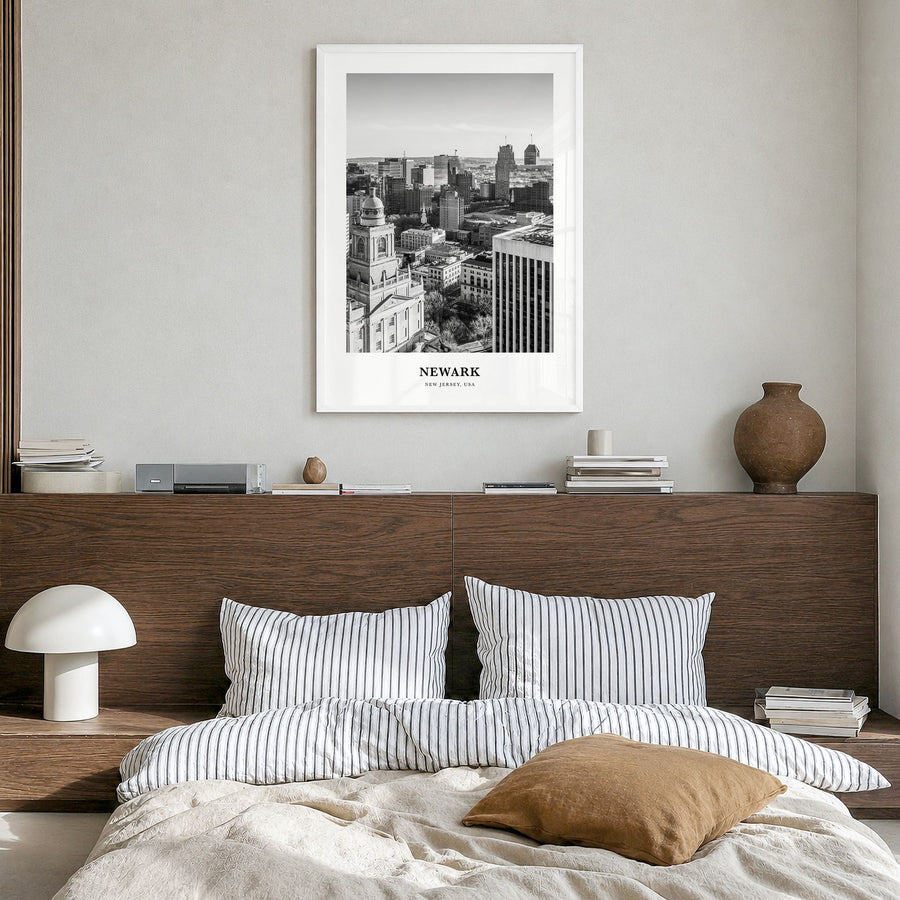 Newark Classic Poster in a white wood frame, hanging in a bedroom