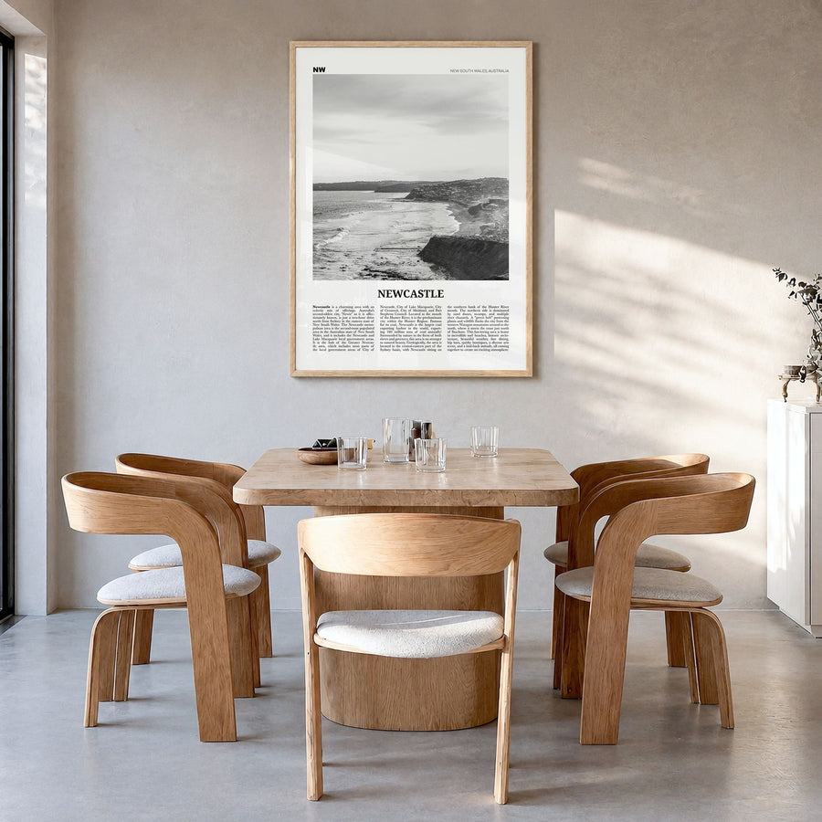 Newcastle, Australia Newspaper Poster in a natural wood frame, hanging in a dining room