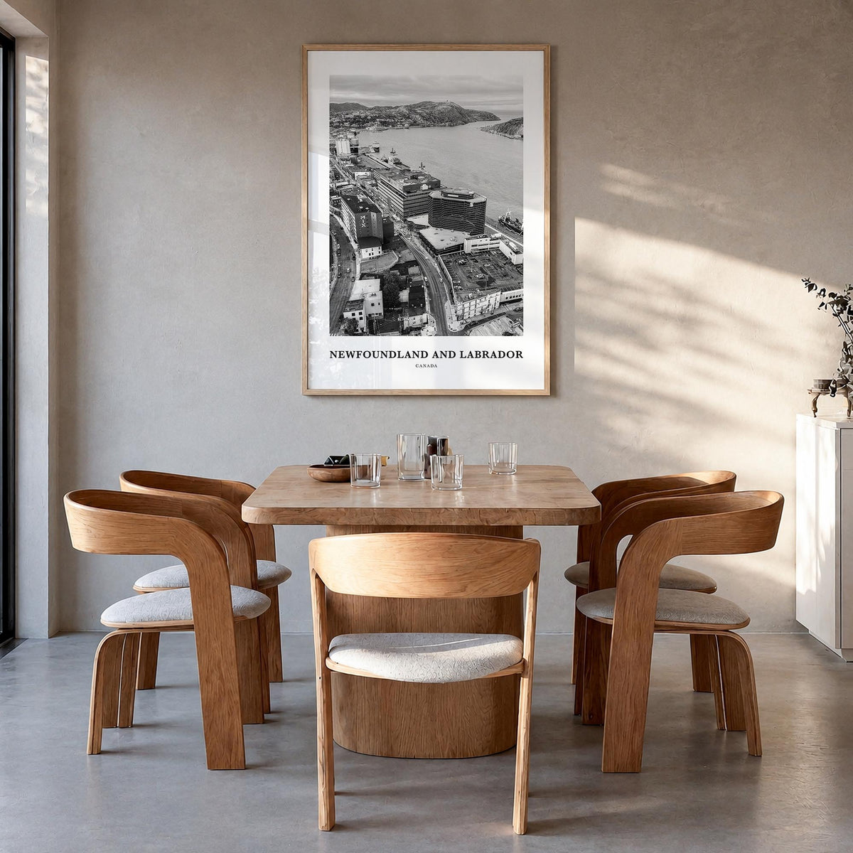 Newfoundland and Labrador black & white classic poster of Canada – vertical wall art in natural wood frame, hanging on wall