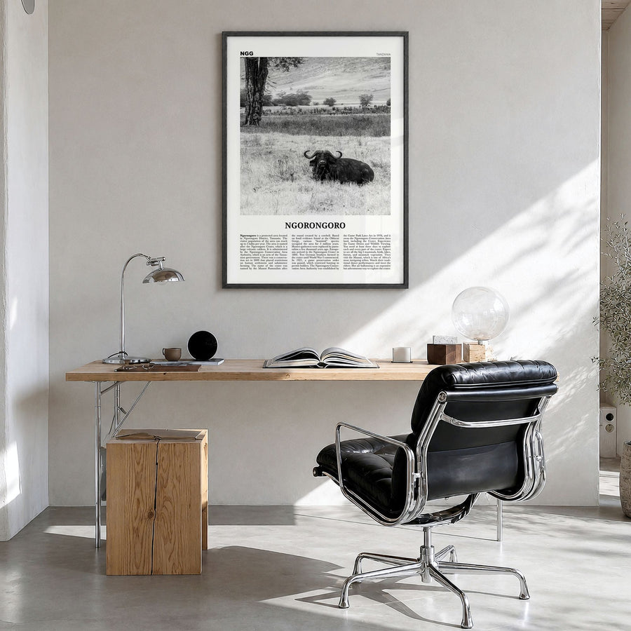 Ngorongoro Newspaper Poster in a black wood frame, hanging in a bright home office