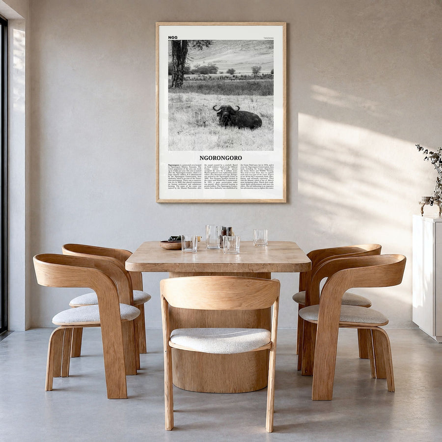 Ngorongoro Newspaper Poster in a natural wood frame, hanging in a dining room