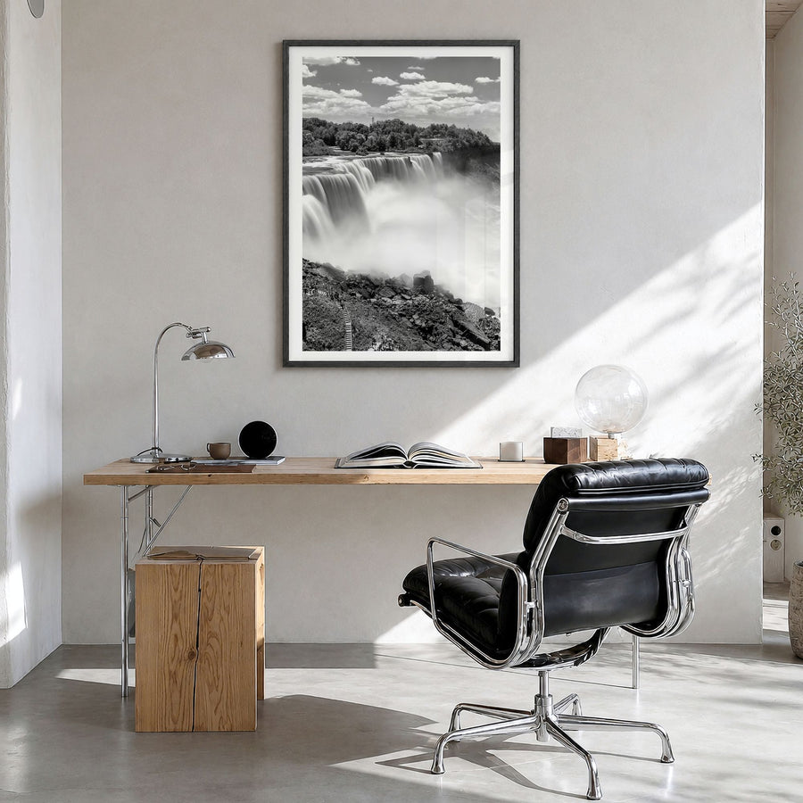 Niagara Falls Photo Poster in a black wood frame, hanging in a bright home office, white border