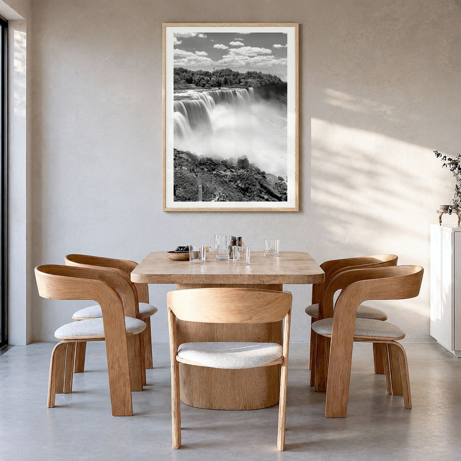 Niagara Falls Photo Poster in a natural wood frame, hanging in a dining room, white border