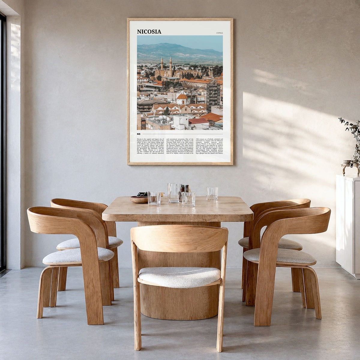 Nicosia Travel Poster in a natural wood frame, hanging in a dining room