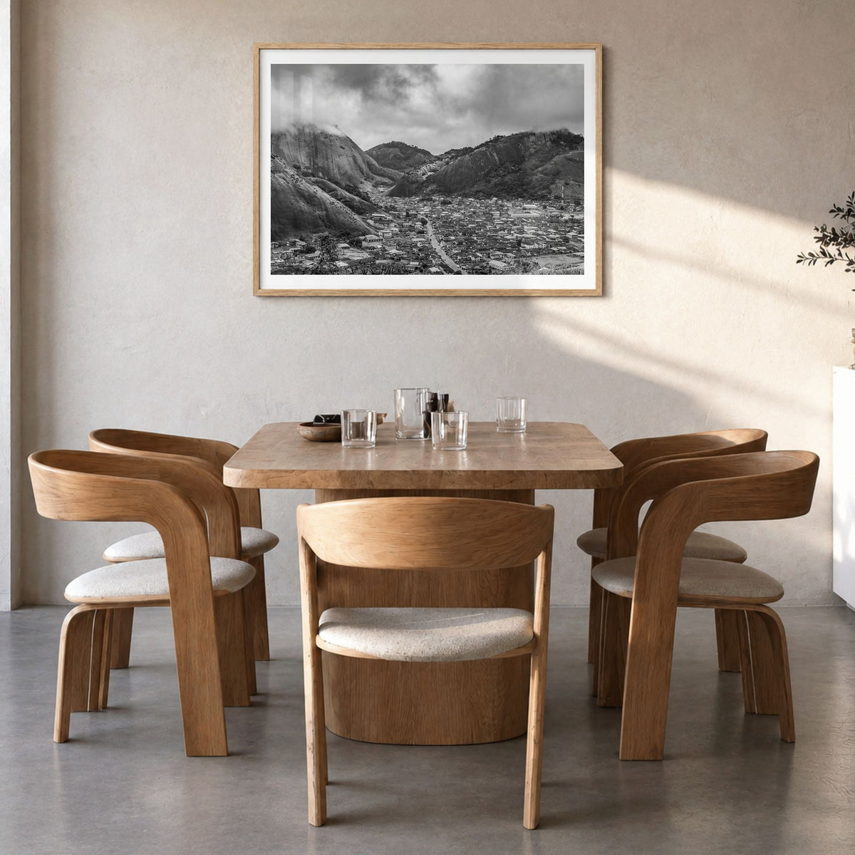 Nigeria Photo Poster in a natural wood frame, hanging in a dining room, white border