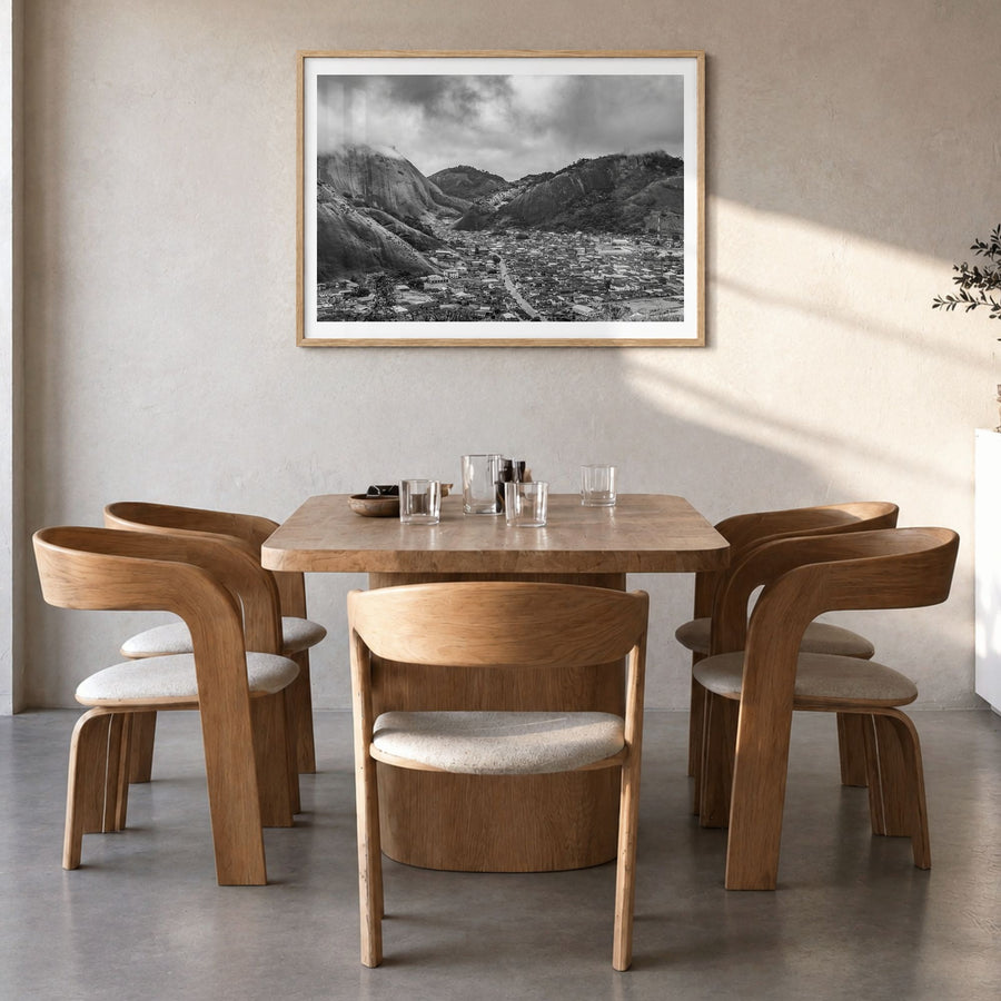 Nigeria Photo Poster in a natural wood frame, hanging in a dining room, white border