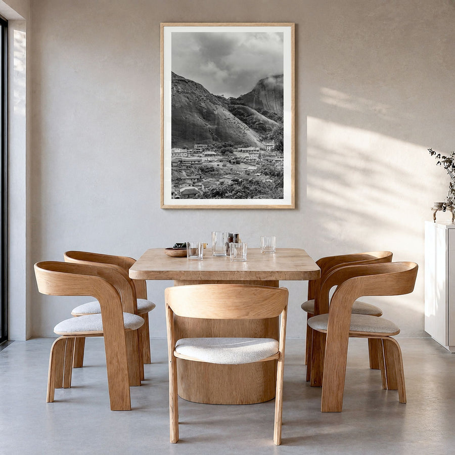 Nigeria Photo Poster in a natural wood frame, hanging in a dining room, white border