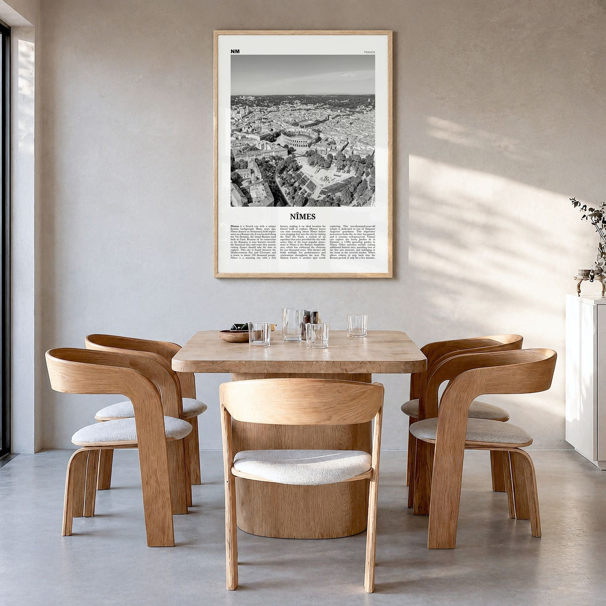 Nîmes Newspaper Poster in a natural wood frame, hanging in a dining room