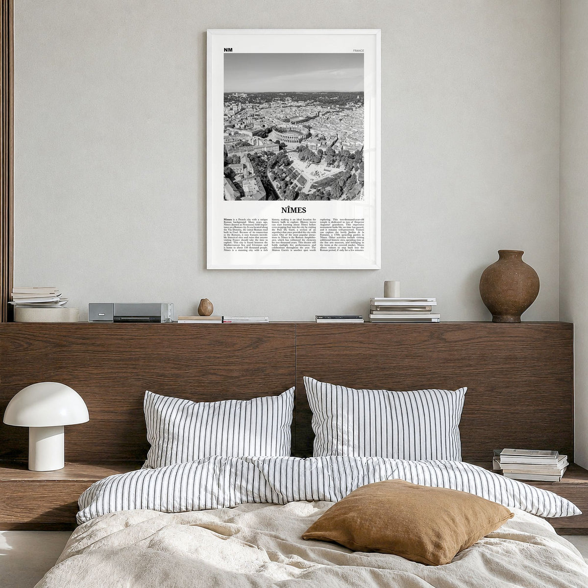 Nîmes Newspaper Poster in a white wood frame, hanging in a bedroom