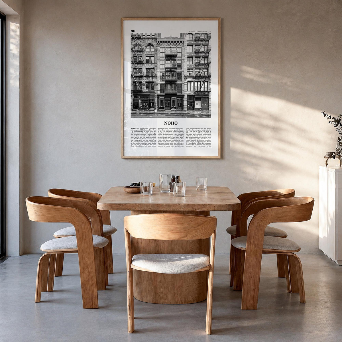 NoHo black & white newspaper poster of Manhattan, New York City – vertical wall art in natural wood frame, hanging on wall