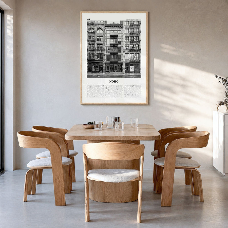 NoHo Newspaper Poster in a natural wood frame, hanging in a dining room