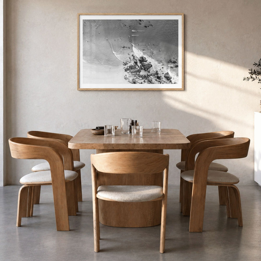 Noosa Heads Photo Poster in a natural wood frame, hanging in a dining room, white border