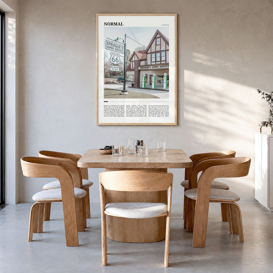 Normal Travel Poster in a natural wood frame, hanging in a dining room