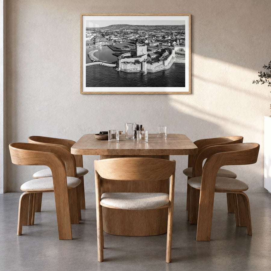Norman Photo Poster in a natural wood frame, hanging in a dining room, white border
