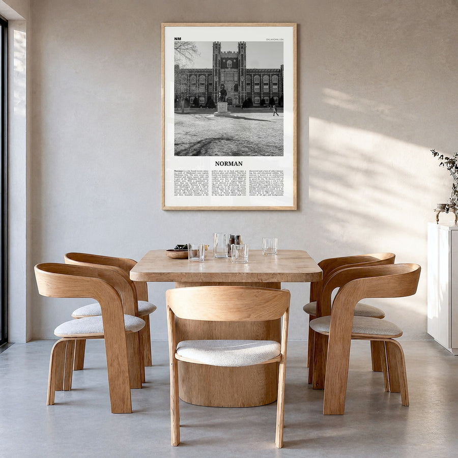 Norman Newspaper Poster in a natural wood frame, hanging in a dining room